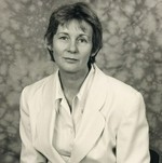 Brenda Seymour seated portrait in white.jpg